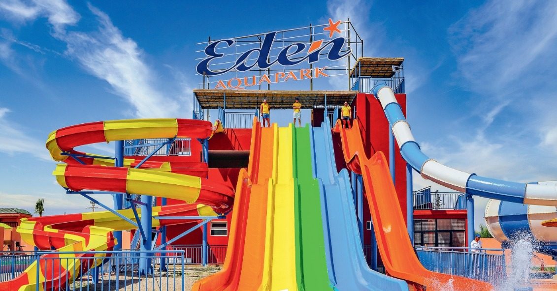 Eden Aquapark Marrakech slide tower with the park sign and the 4-lane MultiSlide